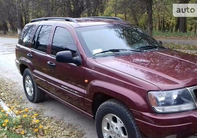 Червоний Джип Grand Cherokee, об'ємом двигуна 4 л та пробігом 153 тис. км за 8100 $, фото 1 на Automoto.ua