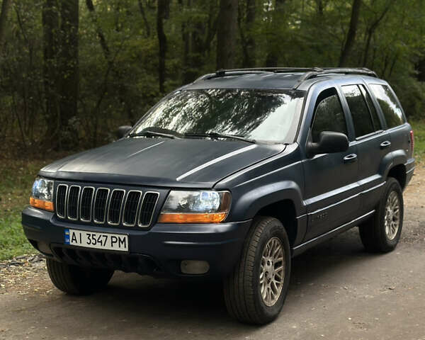 Синий Джип Гранд Чероки, объемом двигателя 3.96 л и пробегом 311 тыс. км за 5400 $, фото 1 на Automoto.ua