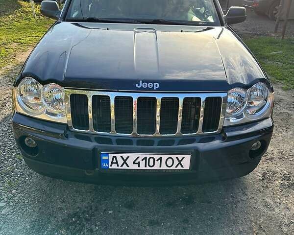 Синий Джип Гранд Чероки, объемом двигателя 5.65 л и пробегом 198 тыс. км за 11500 $, фото 1 на Automoto.ua