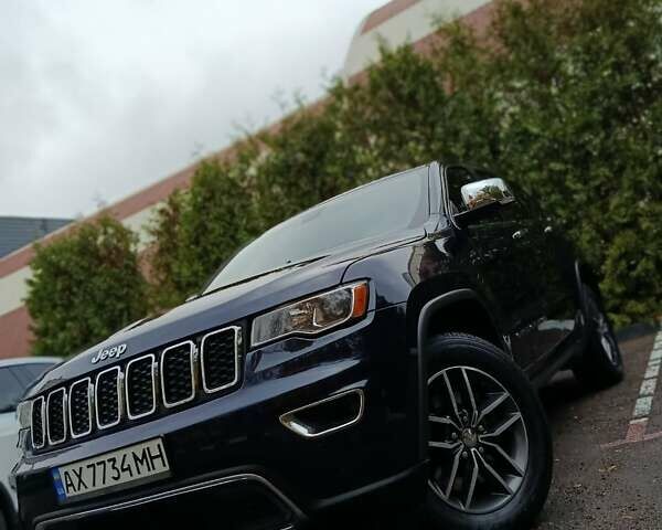 Синий Джип Гранд Чероки, объемом двигателя 5.65 л и пробегом 128 тыс. км за 27400 $, фото 1 на Automoto.ua