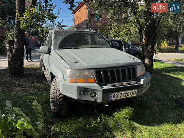 Зеленый Джип Гранд Чероки, объемом двигателя 5.2 л и пробегом 300 тыс. км за 1999 $, фото 1 на Automoto.ua
