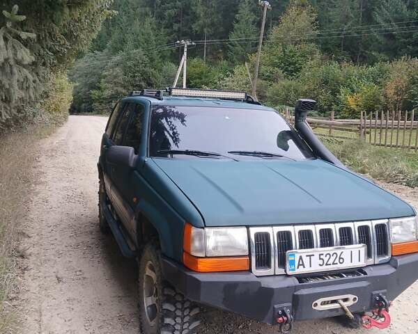 Зеленый Джип Гранд Чероки, объемом двигателя 2.5 л и пробегом 312 тыс. км за 9600 $, фото 1 на Automoto.ua