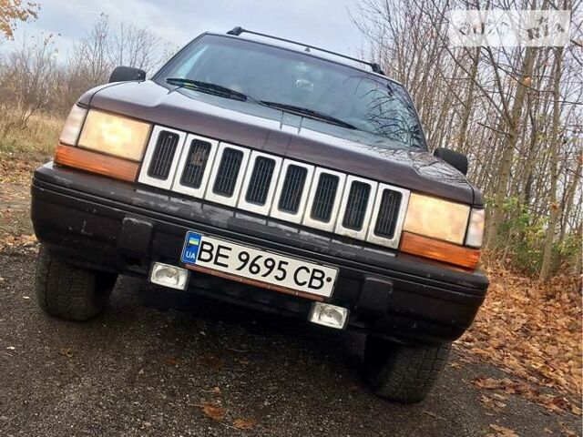 Зелений Джип Grand Cherokee, об'ємом двигуна 5.2 л та пробігом 187 тис. км за 4600 $, фото 1 на Automoto.ua