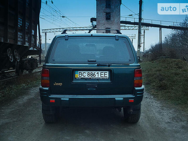 Зелений Джип Grand Cherokee, об'ємом двигуна 4 л та пробігом 84 тис. км за 9800 $, фото 1 на Automoto.ua