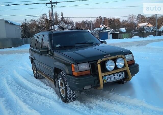 Зелений Джип Grand Cherokee, об'ємом двигуна 5.2 л та пробігом 230 тис. км за 5300 $, фото 1 на Automoto.ua