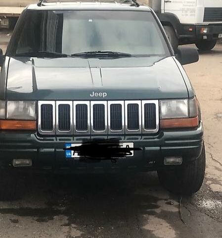 Зелений Джип Grand Cherokee, об'ємом двигуна 2.5 л та пробігом 242 тис. км за 6600 $, фото 1 на Automoto.ua