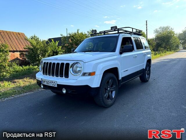 Білий Джип Patriot, об'ємом двигуна 2.4 л та пробігом 82 тис. км за 11200 $, фото 1 на Automoto.ua