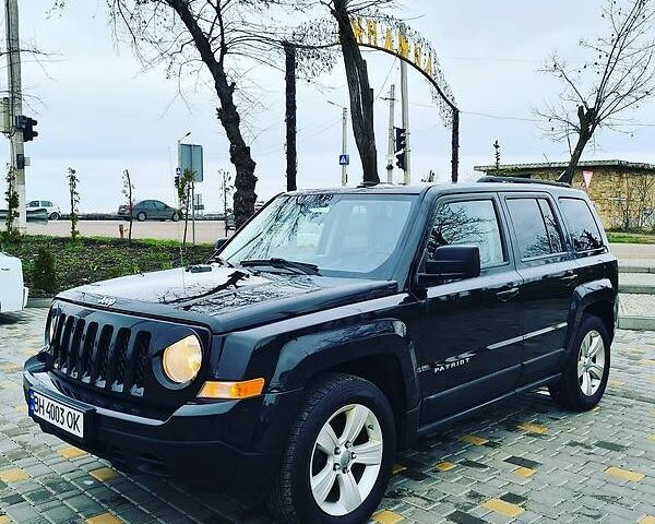 Чорний Джип Patriot, об'ємом двигуна 2.4 л та пробігом 200 тис. км за 8299 $, фото 1 на Automoto.ua