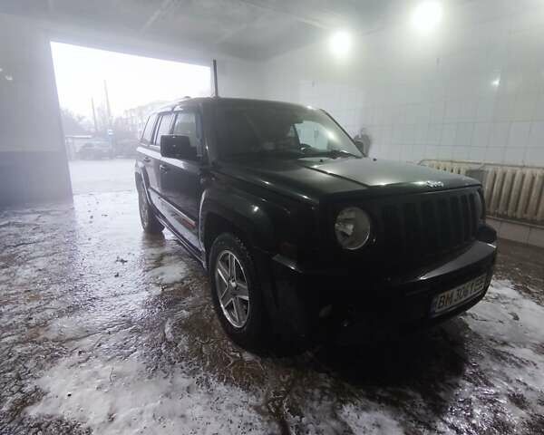 Черный Джип Патриот, объемом двигателя 2.14 л и пробегом 224 тыс. км за 10800 $, фото 1 на Automoto.ua