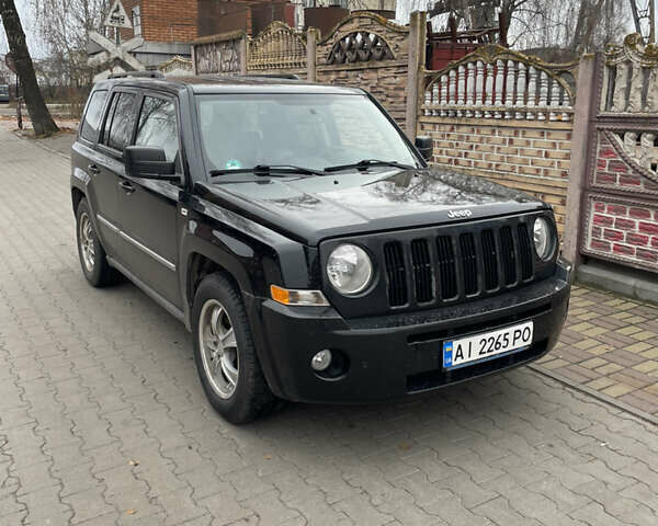 Чорний Джип Patriot, об'ємом двигуна 2.4 л та пробігом 225 тис. км за 9300 $, фото 1 на Automoto.ua