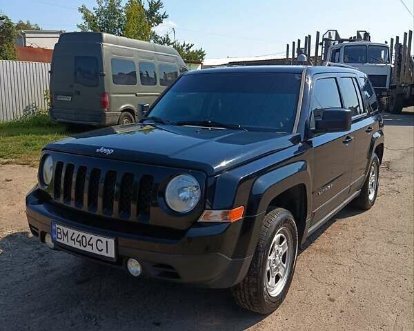 Черный Джип Патриот, объемом двигателя 2.36 л и пробегом 259 тыс. км за 8500 $, фото 1 на Automoto.ua