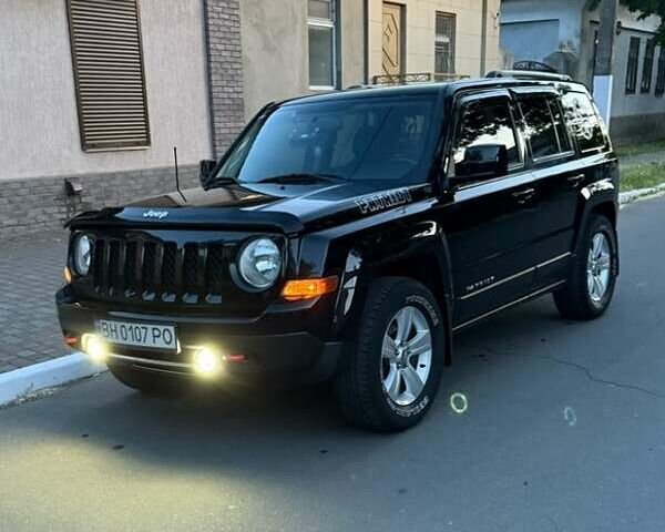 Черный Джип Патриот, объемом двигателя 2.4 л и пробегом 84 тыс. км за 15000 $, фото 1 на Automoto.ua