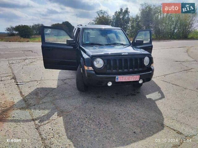 Черный Джип Патриот, объемом двигателя 2.4 л и пробегом 182 тыс. км за 10400 $, фото 1 на Automoto.ua