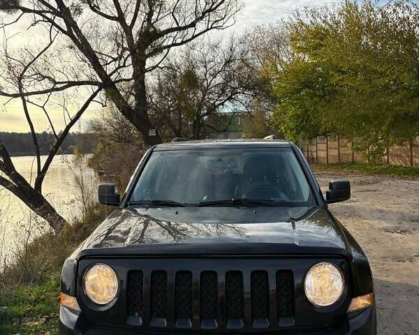 Черный Джип Патриот, объемом двигателя 2.36 л и пробегом 144 тыс. км за 10500 $, фото 1 на Automoto.ua