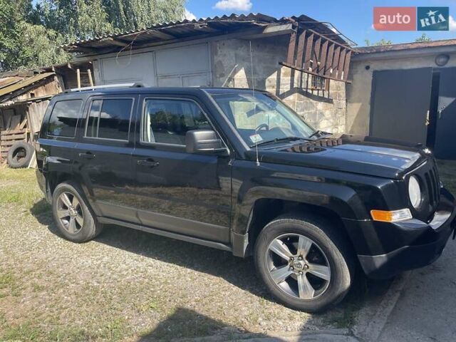 Черный Джип Патриот, объемом двигателя 2.36 л и пробегом 157 тыс. км за 11300 $, фото 1 на Automoto.ua