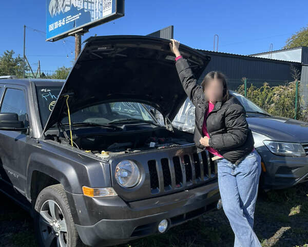 Черный Джип Патриот, объемом двигателя 2.4 л и пробегом 155 тыс. км за 9200 $, фото 1 на Automoto.ua