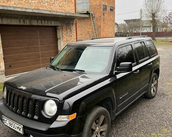 Черный Джип Патриот, объемом двигателя 2.36 л и пробегом 167 тыс. км за 10200 $, фото 1 на Automoto.ua