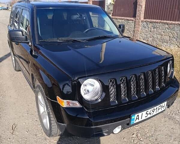 Чорний Джип Patriot, об'ємом двигуна 2 л та пробігом 180 тис. км за 11900 $, фото 1 на Automoto.ua