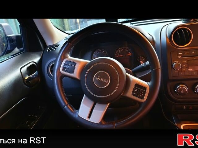 Черный Джип Патриот, объемом двигателя 2.4 л и пробегом 93 тыс. км за 12000 $, фото 1 на Automoto.ua