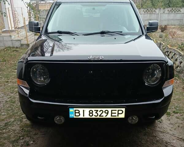 Чорний Джип Patriot, об'ємом двигуна 2.36 л та пробігом 63 тис. км за 12000 $, фото 1 на Automoto.ua