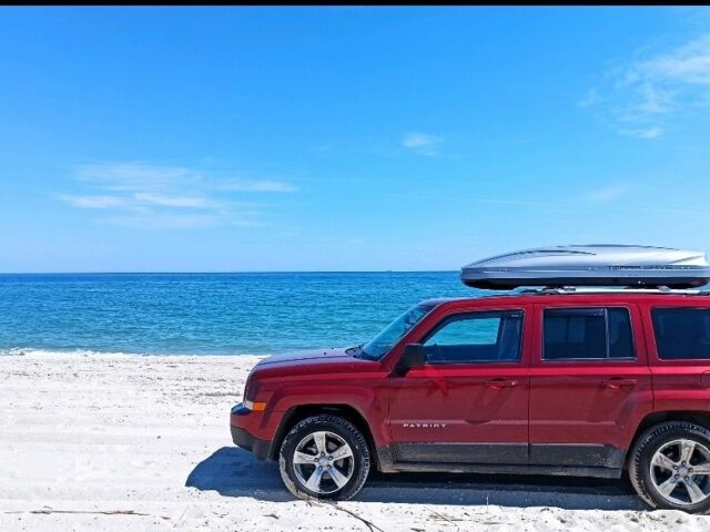 Красный Джип Патриот, объемом двигателя 2.4 л и пробегом 660 тыс. км за 13500 $, фото 1 на Automoto.ua