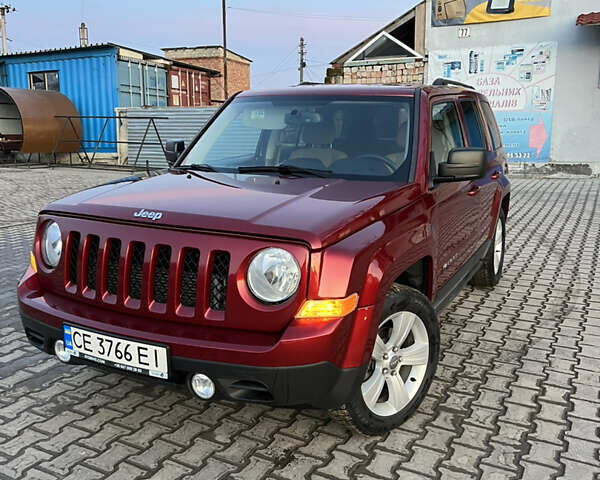Червоний Джип Patriot, об'ємом двигуна 2.4 л та пробігом 150 тис. км за 10250 $, фото 1 на Automoto.ua