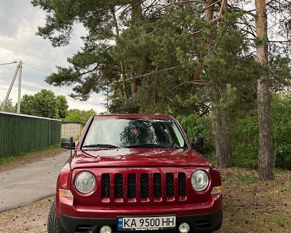 Красный Джип Патриот, объемом двигателя 2 л и пробегом 203 тыс. км за 11500 $, фото 1 на Automoto.ua