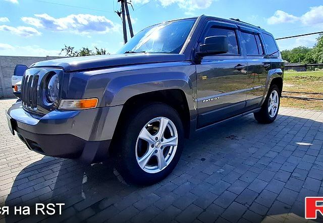 Серый Джип Патриот, объемом двигателя 2.4 л и пробегом 154 тыс. км за 11000 $, фото 1 на Automoto.ua