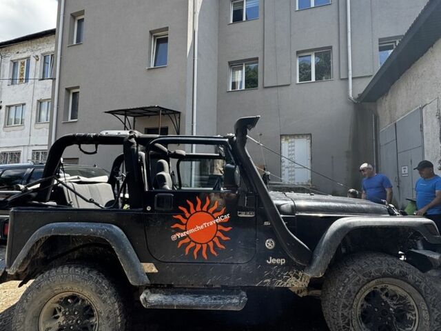Черный Джип Вранглер, объемом двигателя 4 л и пробегом 200 тыс. км за 9200 $, фото 1 на Automoto.ua