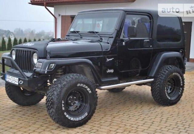 Чорний Джип Wrangler, об'ємом двигуна 2.5 л та пробігом 135 тис. км за 10000 $, фото 1 на Automoto.ua