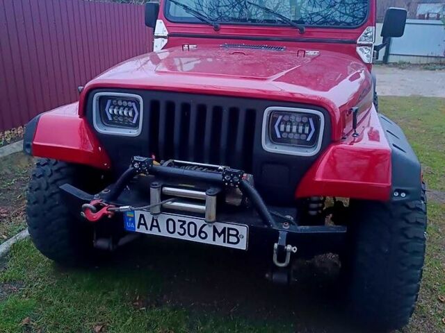 Красный Джип Вранглер, объемом двигателя 4 л и пробегом 200 тыс. км за 14500 $, фото 1 на Automoto.ua