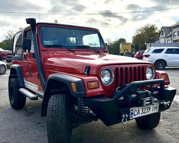 Червоний Джип Wrangler, об'ємом двигуна 2.5 л та пробігом 177 тис. км за 15500 $, фото 1 на Automoto.ua
