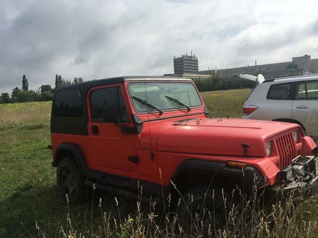 Червоний Джип Wrangler, об'ємом двигуна 4 л та пробігом 215 тис. км за 13500 $, фото 1 на Automoto.ua