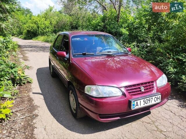 Красный Киа Авелла, объемом двигателя 1.5 л и пробегом 186 тыс. км за 1699 $, фото 1 на Automoto.ua