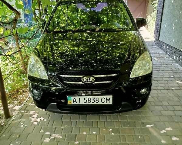 Черный Киа Каренс, объемом двигателя 2 л и пробегом 99 тыс. км за 5500 $, фото 1 на Automoto.ua