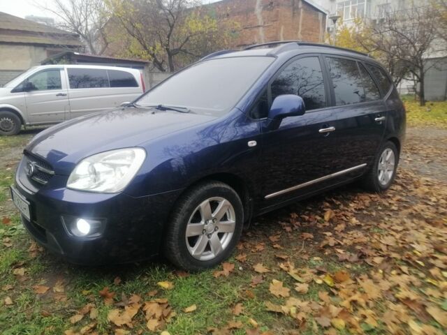 Синий Киа Каренс, объемом двигателя 2 л и пробегом 244 тыс. км за 6000 $, фото 1 на Automoto.ua