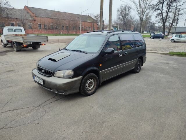 Черный Киа Карнивал, объемом двигателя 2.9 л и пробегом 260 тыс. км за 1500 $, фото 1 на Automoto.ua