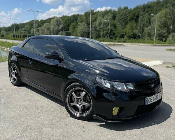 Черный Киа Cerato KOUP, объемом двигателя 2.4 л и пробегом 210 тыс. км за 9000 $, фото 1 на Automoto.ua