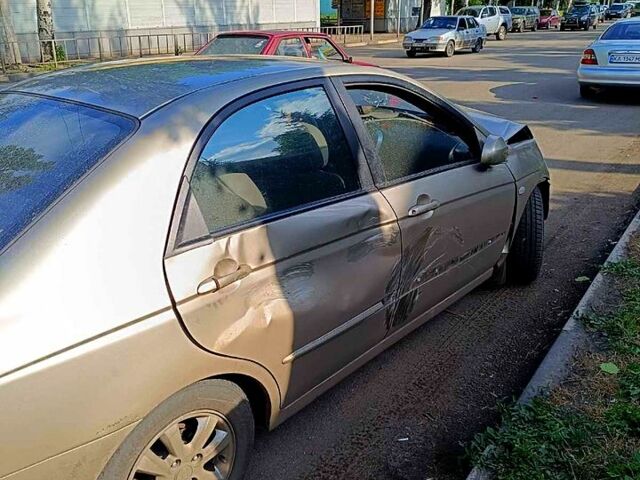 Бежевый Киа Черато, объемом двигателя 1.6 л и пробегом 240 тыс. км за 1600 $, фото 1 на Automoto.ua