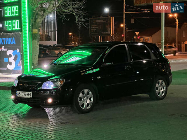 Черный Киа Черато, объемом двигателя 1.6 л и пробегом 150 тыс. км за 4499 $, фото 1 на Automoto.ua