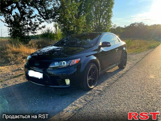 Чорний Кіа Черато, об'ємом двигуна 2 л та пробігом 238 тис. км за 7400 $, фото 1 на Automoto.ua