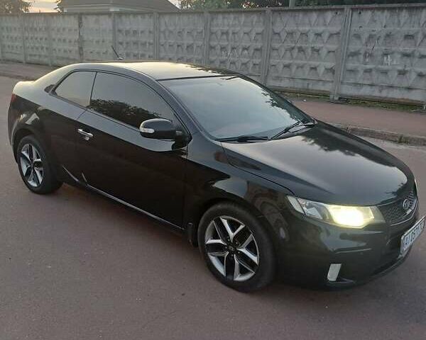 Чорний Кіа Черато, об'ємом двигуна 2 л та пробігом 261 тис. км за 7399 $, фото 1 на Automoto.ua