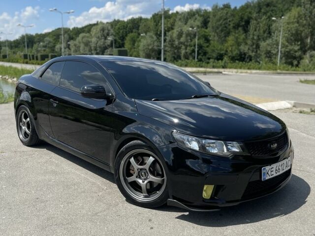 Черный Киа Черато, объемом двигателя 2.4 л и пробегом 210 тыс. км за 9500 $, фото 1 на Automoto.ua
