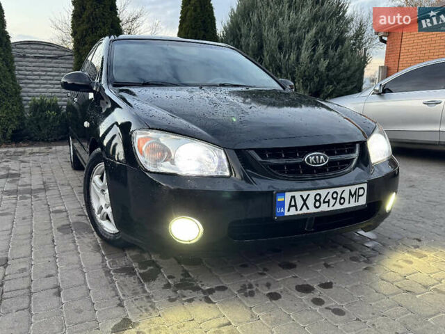 Черный Киа Черато, объемом двигателя 2 л и пробегом 318 тыс. км за 3900 $, фото 1 на Automoto.ua