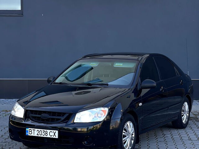 Черный Киа Черато, объемом двигателя 1.6 л и пробегом 230 тыс. км за 3900 $, фото 1 на Automoto.ua