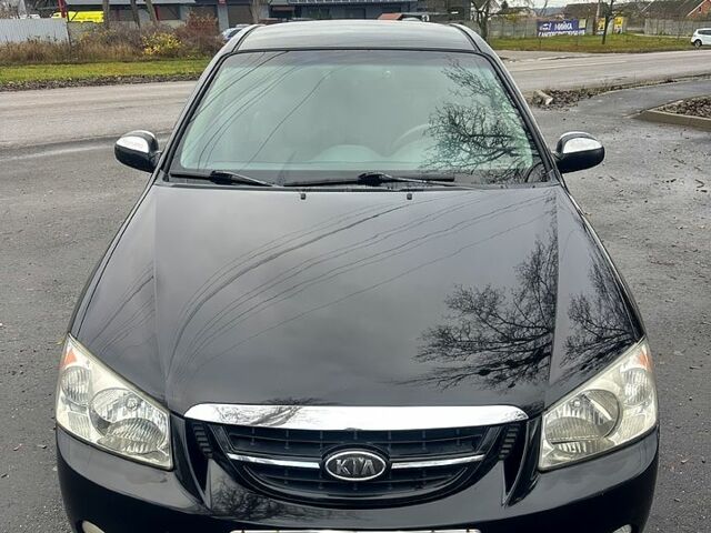 Черный Киа Черато, объемом двигателя 2 л и пробегом 232 тыс. км за 4100 $, фото 1 на Automoto.ua