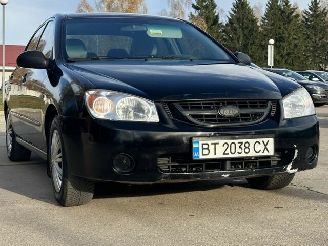 Черный Киа Черато, объемом двигателя 1.6 л и пробегом 245 тыс. км за 2850 $, фото 1 на Automoto.ua