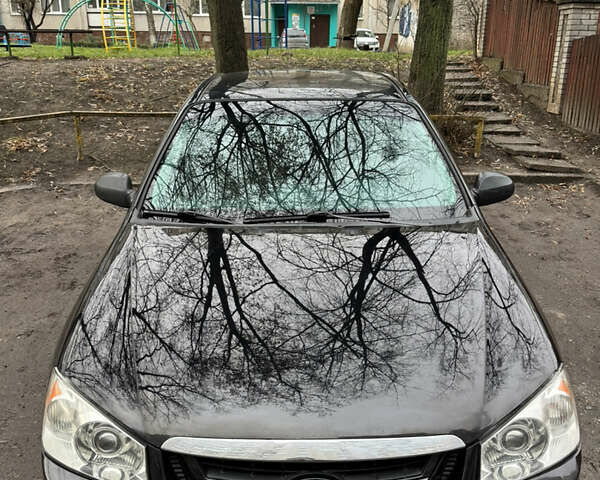 Черный Киа Черато, объемом двигателя 1.6 л и пробегом 312 тыс. км за 4100 $, фото 1 на Automoto.ua