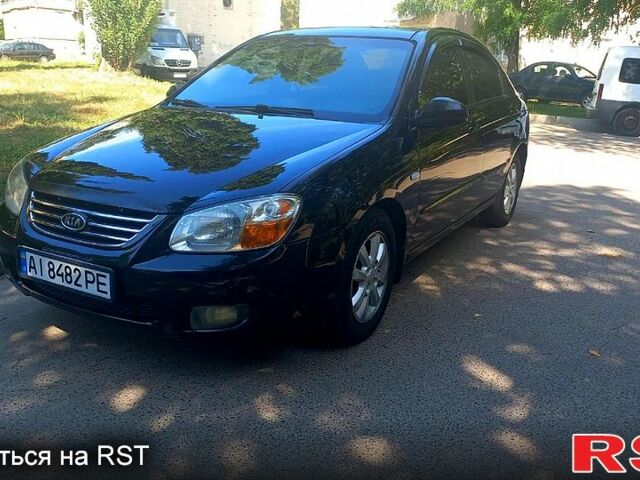 Чорний Кіа Черато, об'ємом двигуна 2 л та пробігом 203 тис. км за 4500 $, фото 1 на Automoto.ua