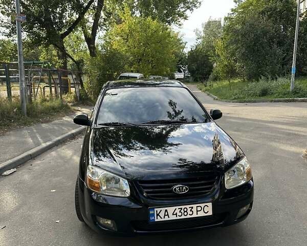 Черный Киа Черато, объемом двигателя 1.6 л и пробегом 181 тыс. км за 3900 $, фото 1 на Automoto.ua